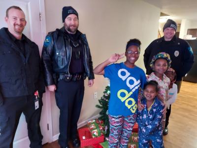 Faribault police chief and officers deliver gifts to families