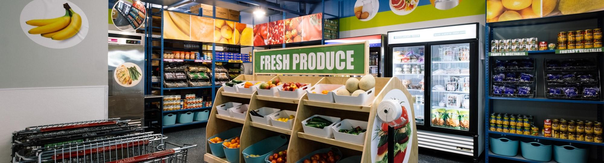 Modern food shelf with fresh produce display in center of room