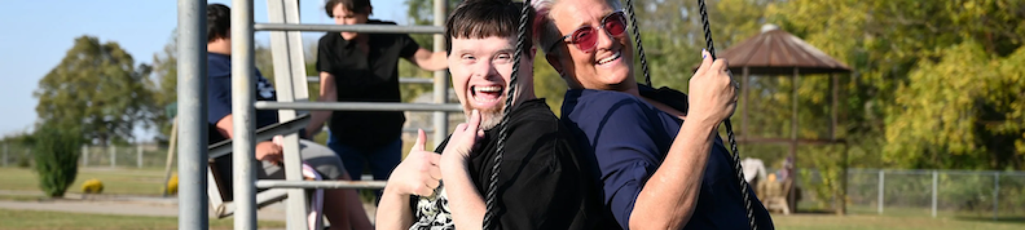 Adults at A Great Day Farm enjoy a swing together