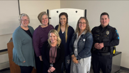 HOPE Center staff and partners at a program for Domestic Violence Awareness Month
