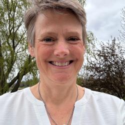 Outdoor head photo of Tory B smiling