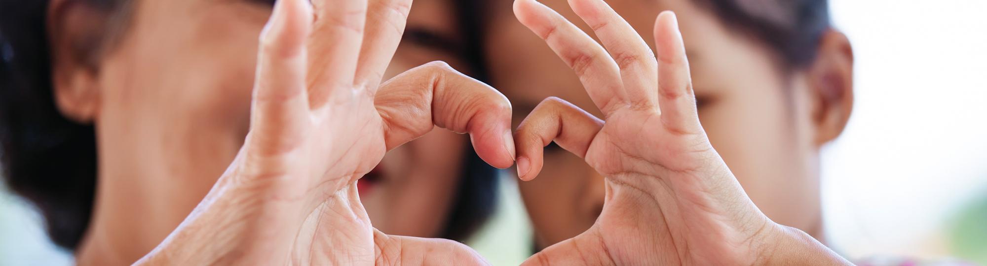 fingers in the shape of a heart